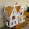 No shipping. Beautiful dollhouse kit is ready to be finished. Table top style house stands 40
