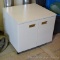 Steel office cabinet with interior shelf is on casters for easy moving. 26