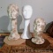 Three foam mannequin heads - two have been decoupaged and mounted loosely on bases. Tallest is 18