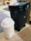 Rubbermaid wheeled garbage tote with handle and lid, plus another garbage can. Rubbermaid can is 36