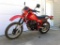 Honda XL 600R Enduro motorcycle. Odometer reads 8859 miles. Plastic and seat are in good condition.
