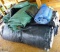 Nice assortment of tarps for firewood, lumber drying, other. Stack as pictured is approx. 6' x