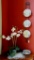 Table and wall display includes faux orchid, 30
