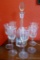 Pretty decanter with glass stopper and six wine glasses have a matching cut grape and leaf design.
