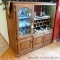 Lighted wine cabinet has been revamped from a nice solid wood entertainment center. Has glass