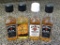 Four small bottles of assorted Jim Beam include two Black Double Aged whiskey, one Honey whiskey and