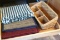 Three sets of placemats; wicker organizer basket measures 14
