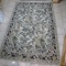 Nice area rug measures approx. 5' x 7-1/2'. In good condition.