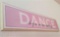 Dance sign around two feet long.