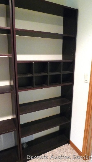 6'8" tall shelving unit has adjustable shelves and seems sturdy and in good condition. Approx. 32"