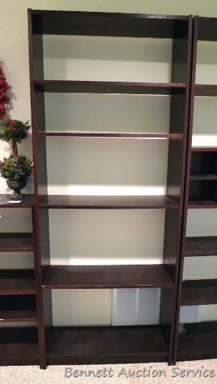 6'8" tall shelving unit has adjustable shelves and seems sturdy and in good condition. Approx. 32"