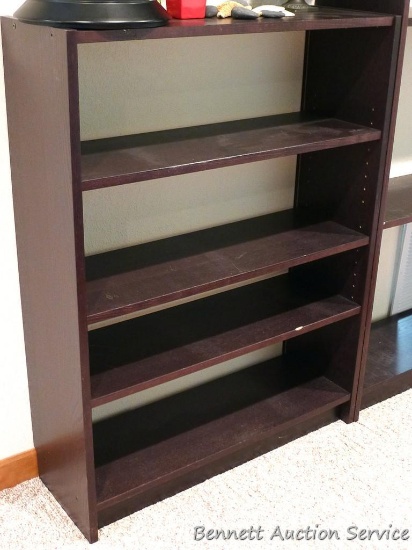 41" tall shelving unit has adjustable shelves and seems sturdy and in good condition. Approx. 32"
