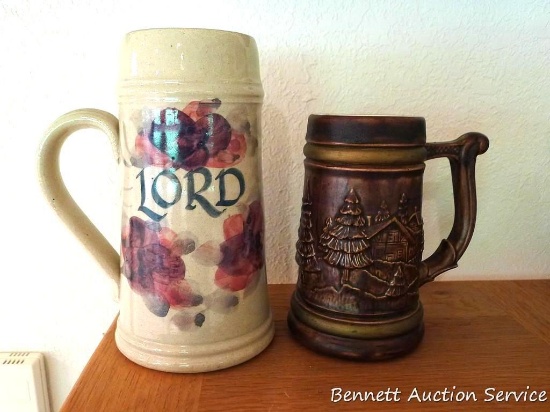 Hand painted stoneware stein is 8" tall. Other stein is marked on bottom 'E. Steines 7L', stands 6".