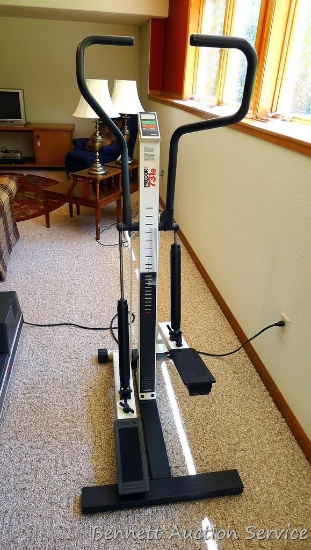 Precor 731e stepper machine works well, has adjustable tension. Stands 5'2" to top of handles.