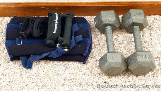15 lb. dumb bells; leg weights may be about 5 lbs each; wrist and hand weights.