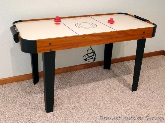 Power Glide air hockey table by Halex measures 5' x 27" x 31" high.