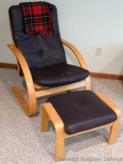 Contemporary chair with ottoman has nice upholstery and comes with a plaid throw. All in very good