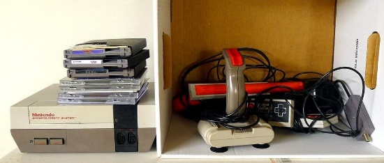 Original Nintendo Entertainment System Model NES-001 appears complete with manual, controllers,