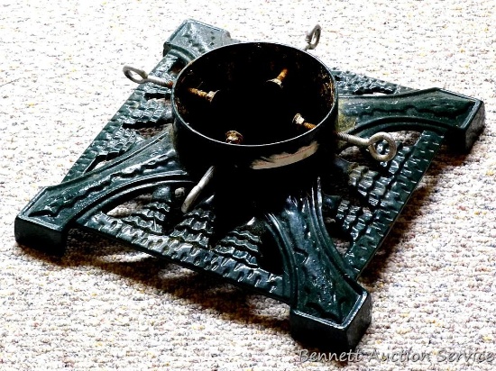 Cast iron Christmas tree stand is very heavy and in good condition, base measures 14" x 14". Nice