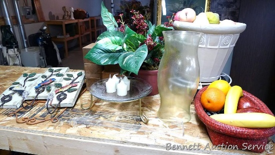 Wall and table decorations including wooden risers, wall hanging with hooks and metal accent, footed