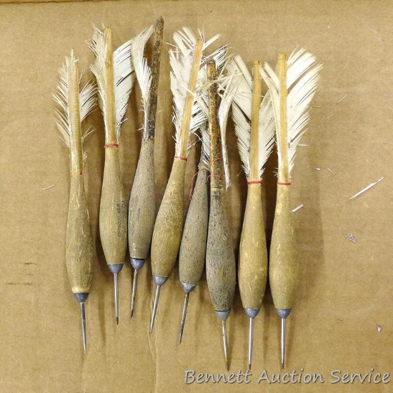 Eight wooden darts. Each is 7" long.