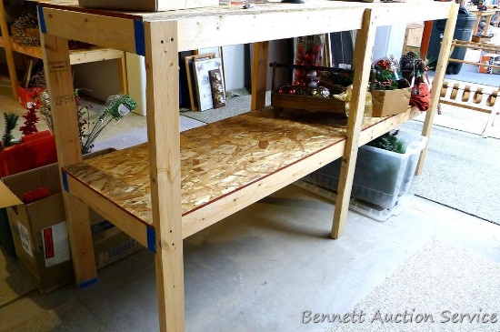 Sturdy wooden shelving unit measures 8' wide x 48" high x 25" across.