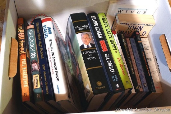 Books including Duck Dynasty books, Decision Points by George W. Bush, Wausau West Alumni, bathroom