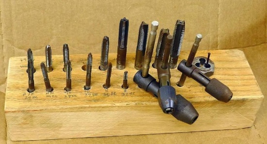 Homemade wooden storage block for tap & die parts from 8/32 to 1/2. Also 3 handles of different