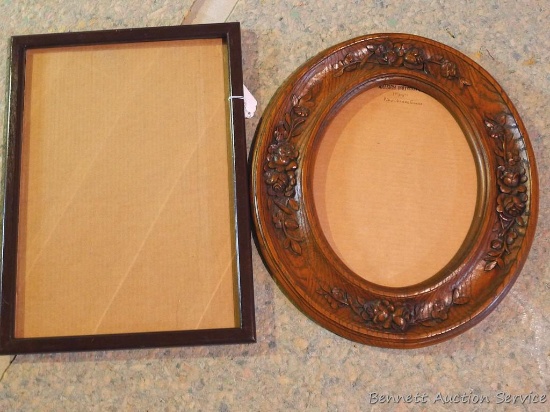 Wooden frame is approx. 18" x 21" and takes an 11" x 14" photo; Other frame is approx 15" x 21"