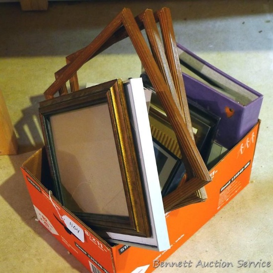 Assorted picture frames and photo albums. Largest frame is approx. 12" x 15".