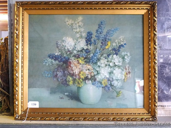 Beautifully ornate frame with floral print. Frame is approx. 32" x 26".