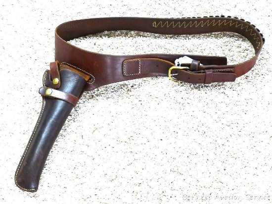 Triple K gun cartridge belt Model 110LC45 has a Triple K 310BP3 holster affixed. Loops are for