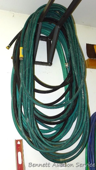 4 assorted garden hoses, 25 to 50 feet each.