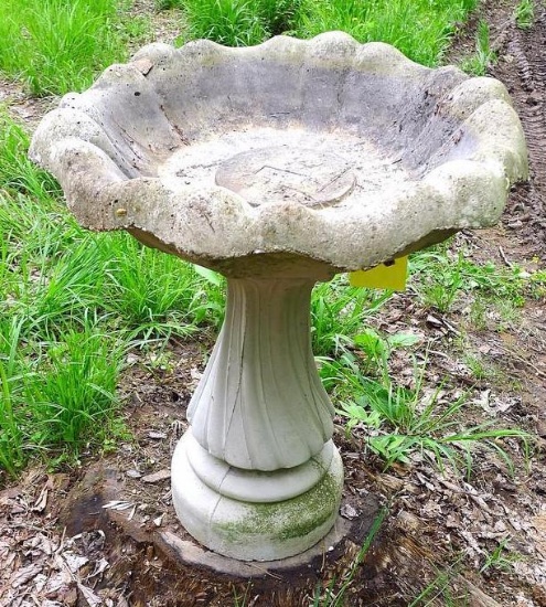 Concrete bird bath stands about 27" tall and is in good shape.