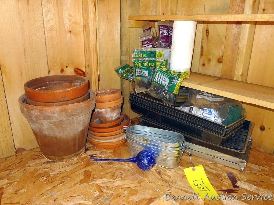 A few seed starting trays, several terra cotta pots and saucers; blown glass watering bulb is 12".