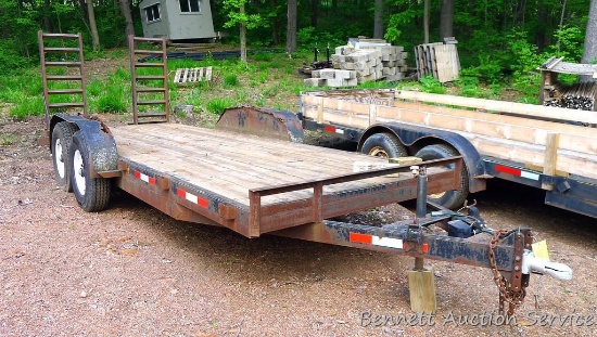 Tandem axle implement trailer with an 18' x 6'6" bed. Hitch is 2-5/16". Rims are eight lug. Tires
