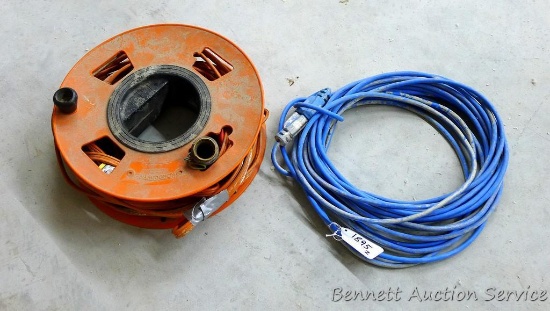 Kord Wynd extension cord reel with cord and other 50 ft extension cord.