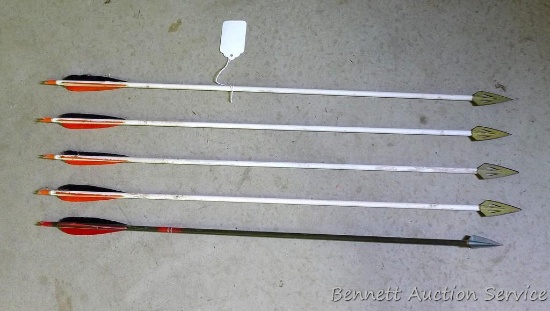 five fiberglass arrows with broad heads are 31" long. Two fiberglass arrows 31" long with rubber