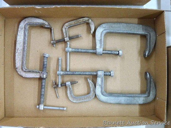 Three 4" C-clamps and two 2" C-clamps.