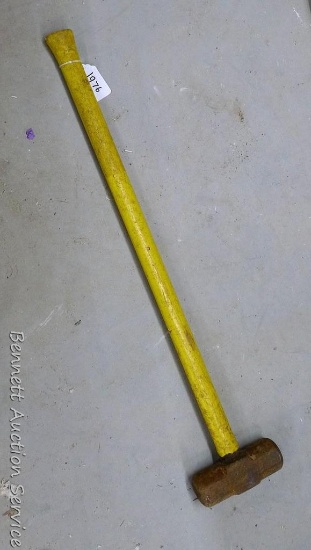 Fiberglass handled sledge hammer with 6-1/2" x 2-1/2" head, 34" length.