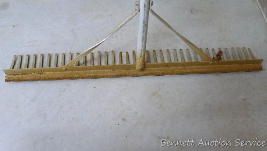 Aluminum landscape rake with 36" head. Handle is cracked just above stiffening braces, should be an