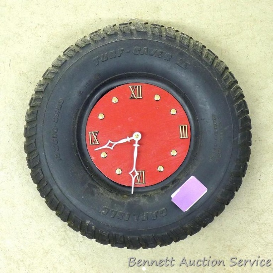 Unique tire clock made from a cut off Carlisle 15 x 6.00-6 tire. Tire is 13-1/2" diameter.