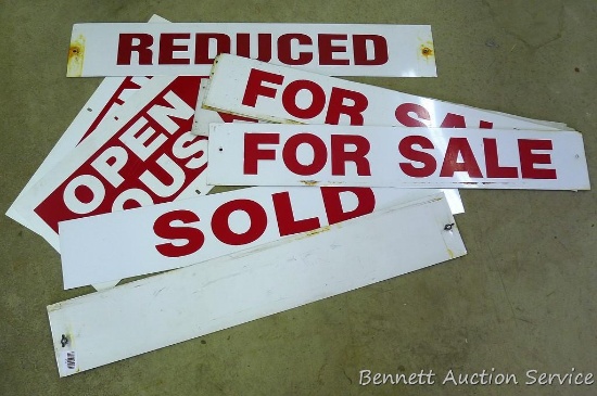 Aluminum signs including For Sale, Reduced, Open House and Sold. Largest is 36" long.