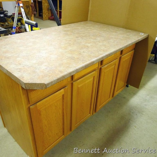 2 Wooden storage cabinets, each with 2 drawers and 2 doors, together they are 60" x 25" x 35".