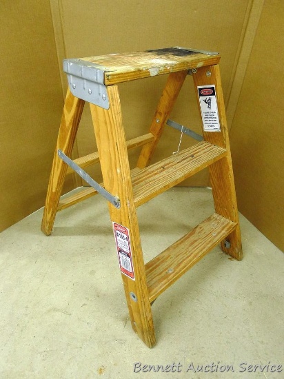Sturdy wooden step stool in good condition is 22" tall.