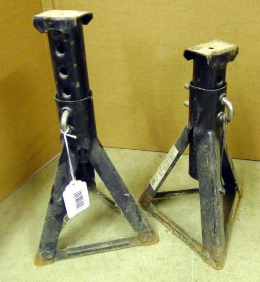 Pair of metal adjustable jack stands are 12" tall in shortest position.
