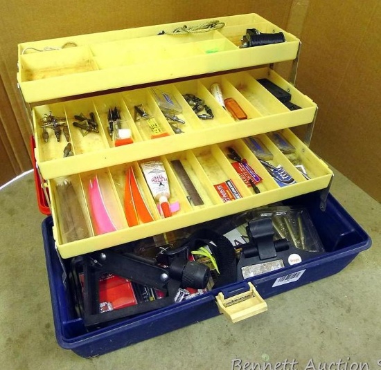Three shelf tackle box filled with archery supplies including broad heads, feathers, nocks,