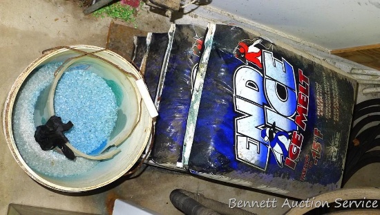 Three 50 lb bags of ice melt, plus a partial bucket full.