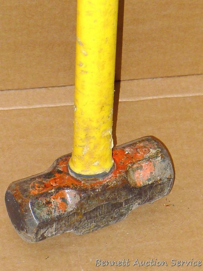 Fiberglass handled sledge hammer has a 6" head x 33" long.