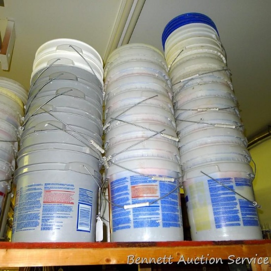 Lots of 5 gallon pails and some lids.